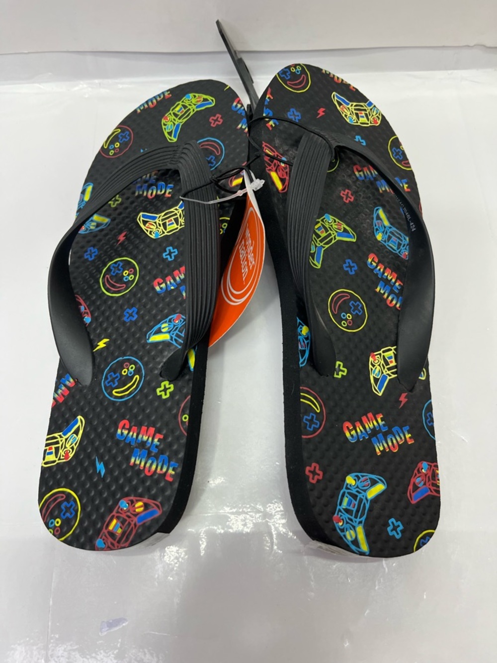 wonder nation Black Flip Flops with Neon Game Controller Print
